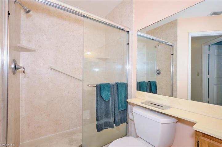 Guest bathroom has walk-in shower.