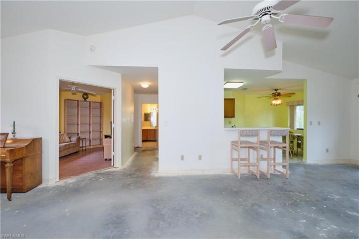 Kitchen features a breakfast bar.