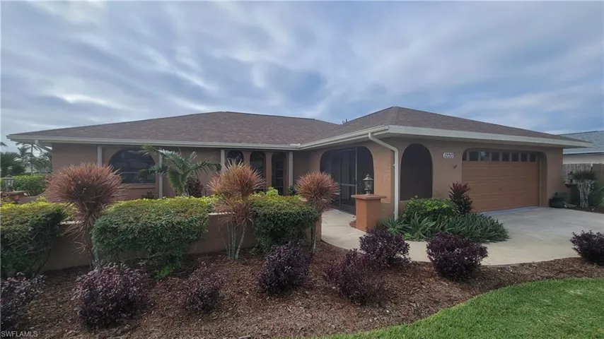 Single story home featuring a garage