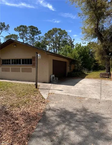 Garage featuring aphalt driveway