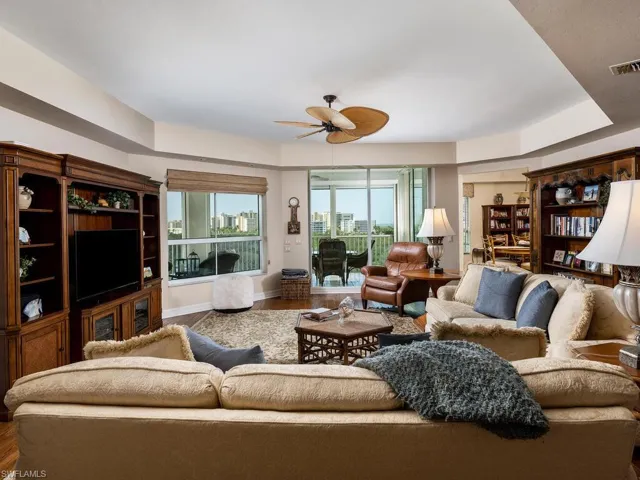 Living area featuring a ceiling fan and wood finished floors
