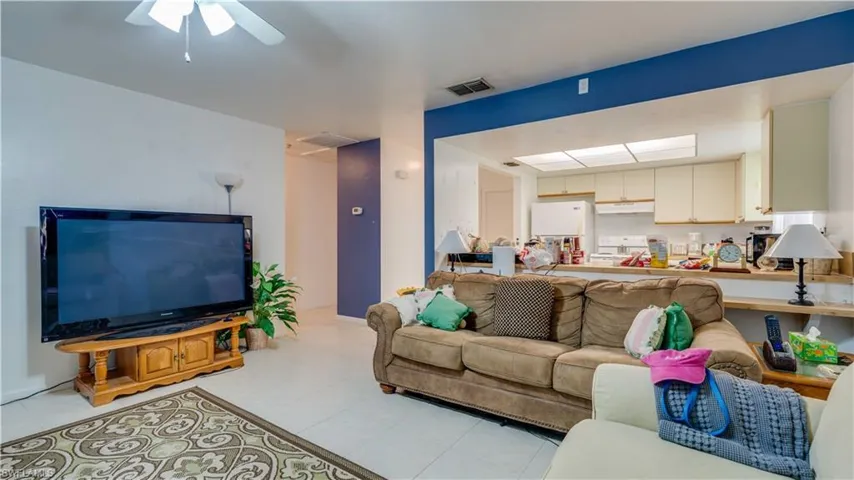 Living room featuring ceiling fan