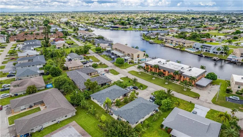 Aerial perspective of suburban area with a nearby body of water