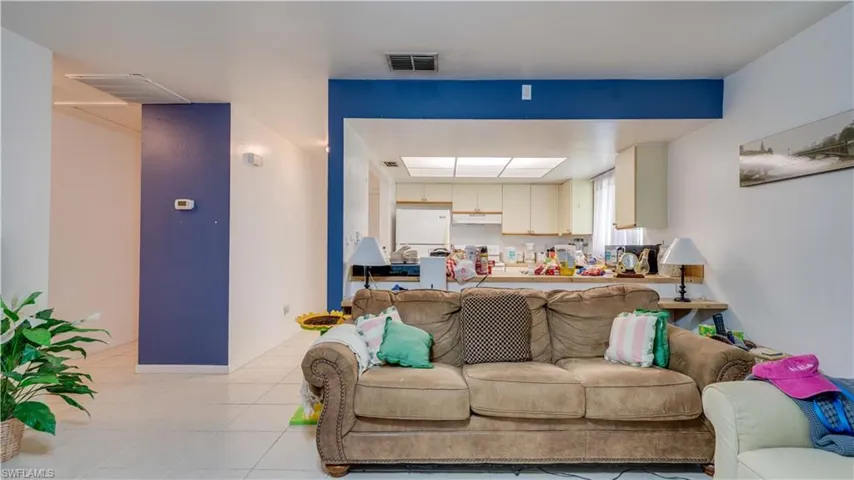 Living room with light tile patterned floors