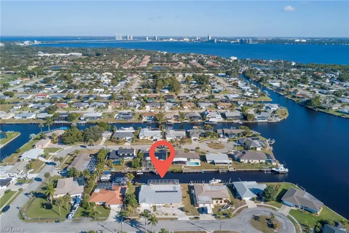 View of property location with nearby suburban area and a nearby body of water