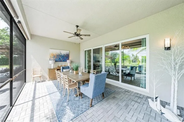 Sunroom featuring ceiling fan
