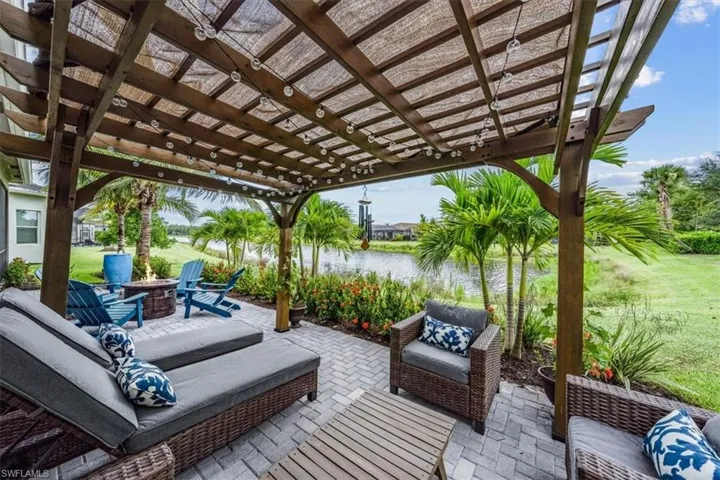 View of patio / terrace with a pergola, a water view, and an outdoor hangout area