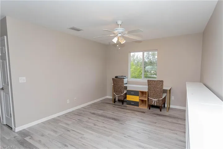 Office space featuring light wood-style flooring and ceiling fan