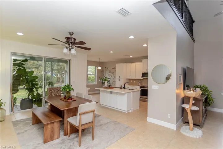 Dining room with a ceiling fan and recessed lighting