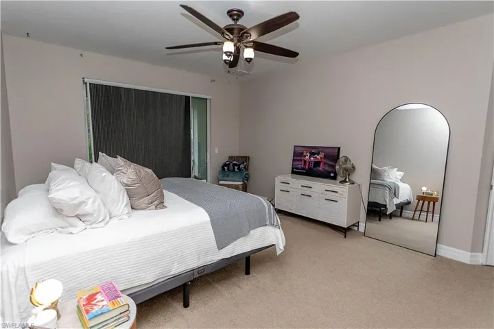 Bedroom with carpet floors and ceiling fan