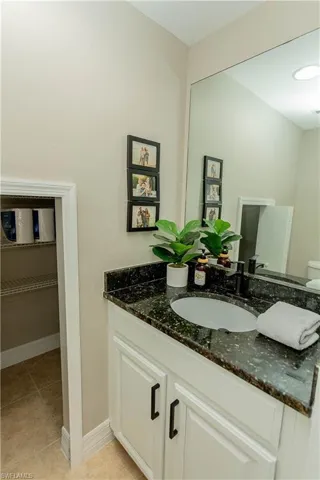 Bathroom with vanity and light tile patterned floors