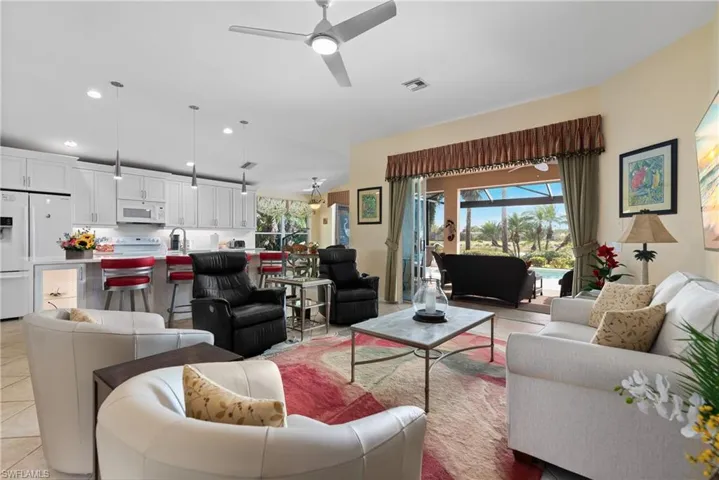 Living area featuring ceiling fan, visible vents, recessed lighting, and light tile patterned floors