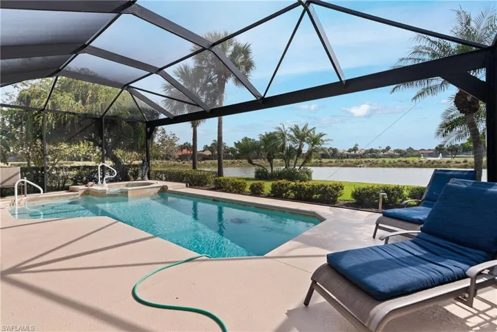 View of swimming pool with a lanai, ceiling fan, an outdoor living space, a grill, and a patio area