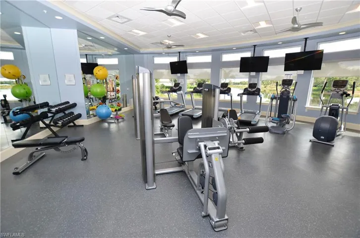 Workout area featuring baseboards