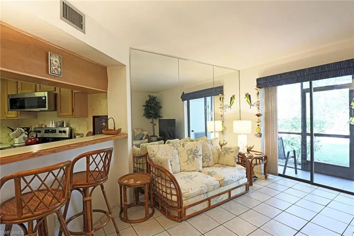 Living area with light tile patterned floors