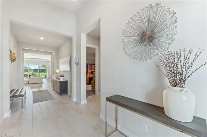 Hallway featuring baseboards and light wood finished floors