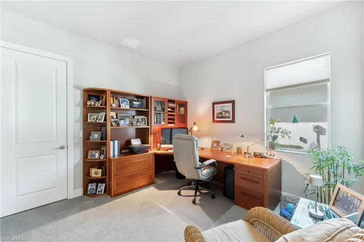 Home office with light colored carpet