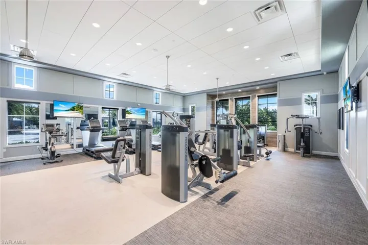 Exercise room featuring recessed lighting, visible vents, baseboards, and carpet flooring