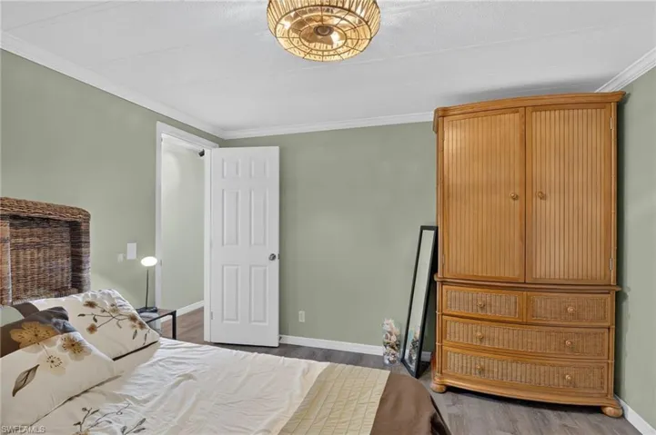 Guest Bedroom with a decorative ceiling fixture