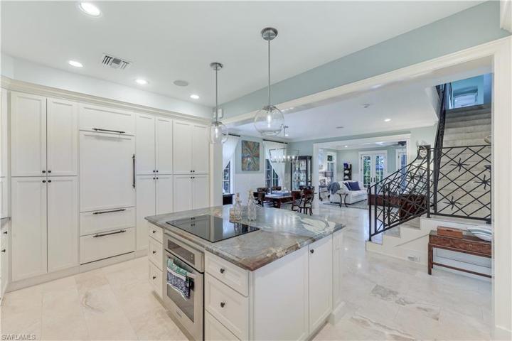 Cooking/baking onyx island continues to 2nd level staircase, lg dining area and great room featuring French doors!