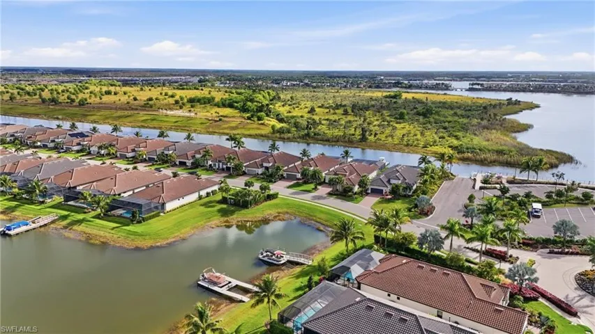 Aerial perspective of suburban area with a large body of water