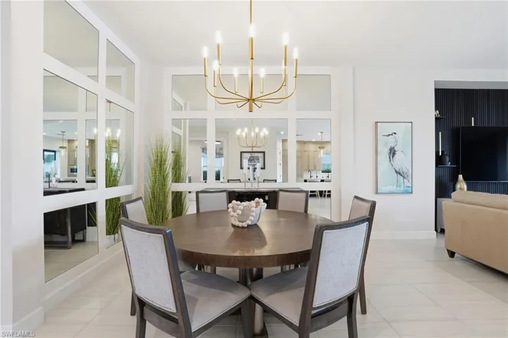 Dining room featuring a chandelier and light tile patterned floors