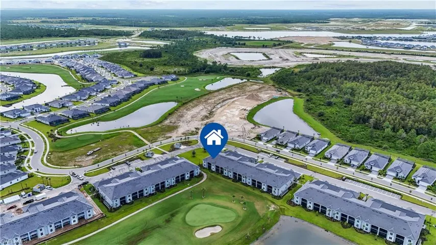 Expansive residential development featuring multiple housing styles, golf course access, and extensive water features