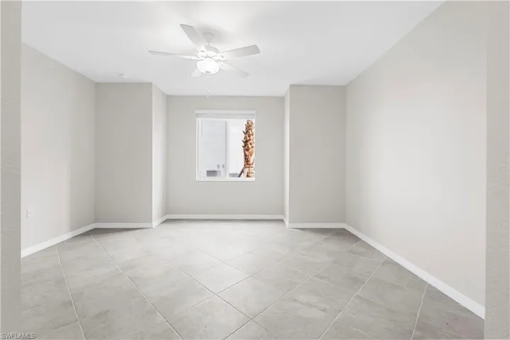 Neutral wall color, ceiling fan, recessed lighting, diagonal tile flooring, and window with blinds