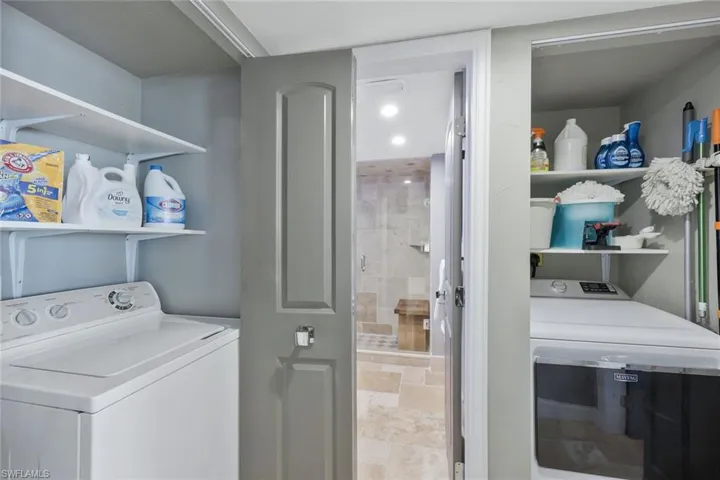 Laundry area featuring washer and clothes dryer and laundry area