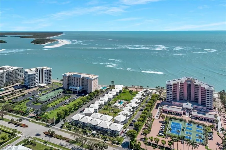 Birds eye view of property featuring a view of city and a water view