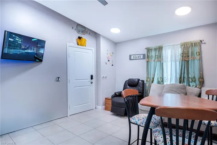 Dining space featuring light tile flooring