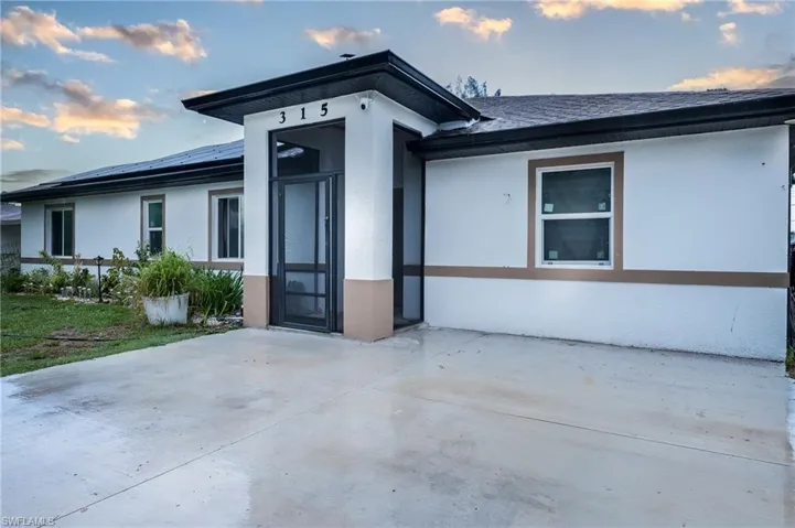 Entrance to property with a patio