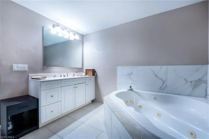 Bathroom with tile floors and large vanity