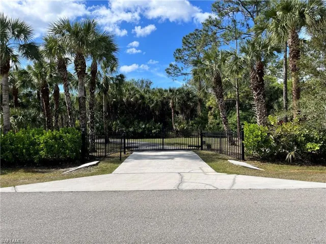 View of concrete surface featuring a gate