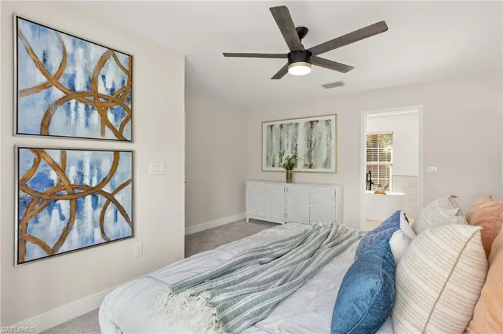 Master Bedroom featuring carpet floors, a ceiling fan, and master bathroom