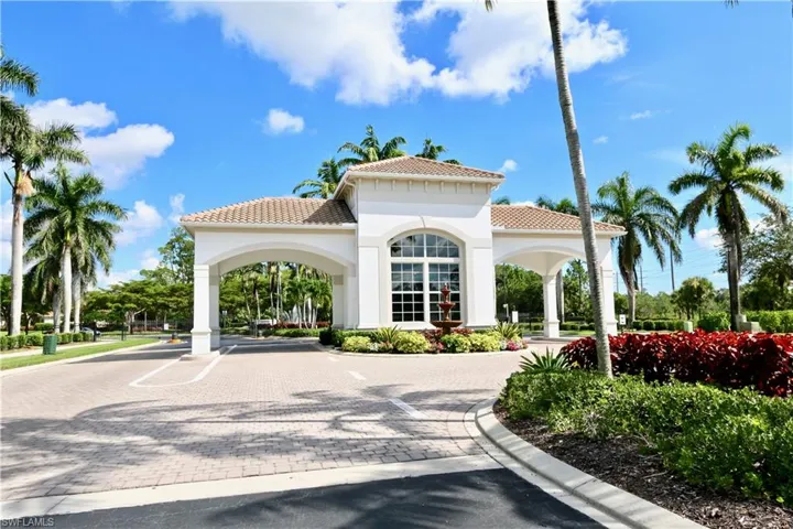 Mediterranean-inspired entrance structure with a tiled roof and arched passageways