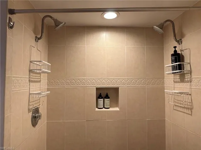 Full bath featuring tiled shower