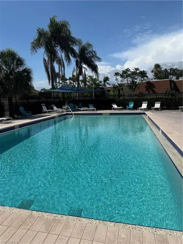 Community pool featuring a patio area