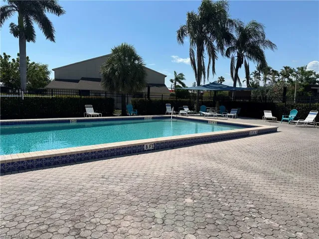 Community pool featuring a patio area