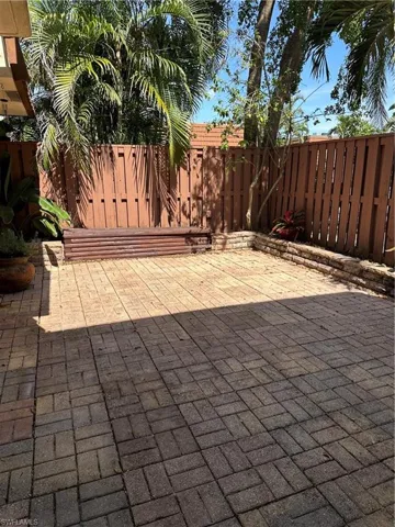 Fenced backyard with a patio area