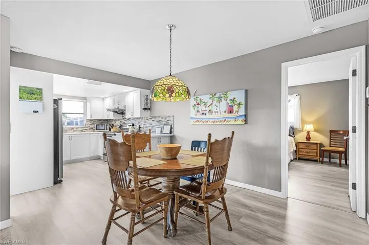 Dining has views of the pool.  Primary bedroom on the right.
