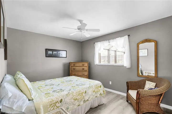 Guest Bedroom #2, view 1, with views of the pool and canal.