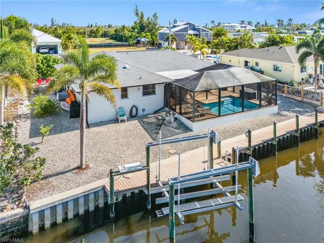 New Vinyl Seawall & 7K# boat lift in 2014 by Honc.