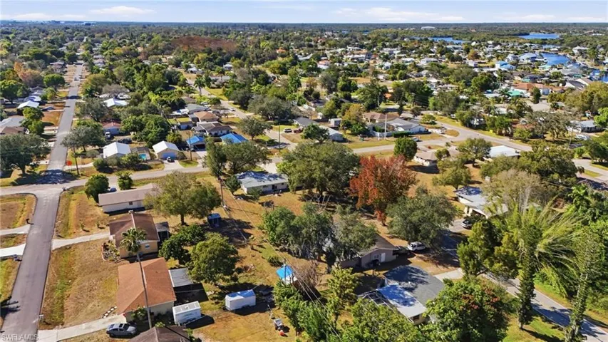 View of property location with nearby suburban area