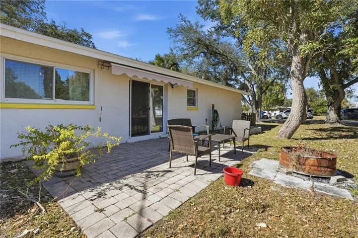 View of patio featuring an outdoor fire pit
