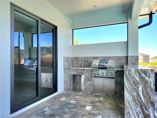 View of patio / terrace featuring an outdoor kitchen