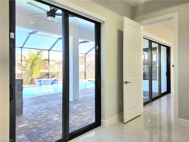 Entryway with a sunroom and ceiling fan