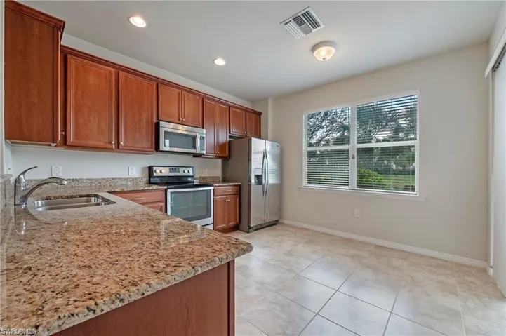 Kitchen accommodates a small bistro table, or portable island