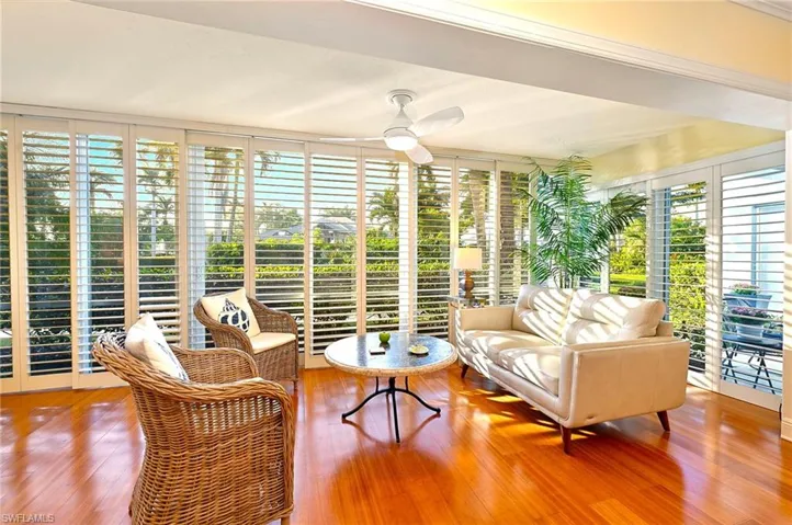 Sunroom / solarium with ceiling fan and plenty of natural light