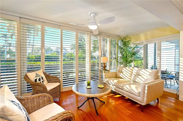Sunroom / solarium featuring ceiling fan and a wealth of natural light